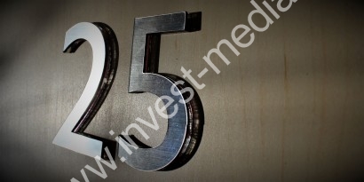 silver numbers on the door to the rooms